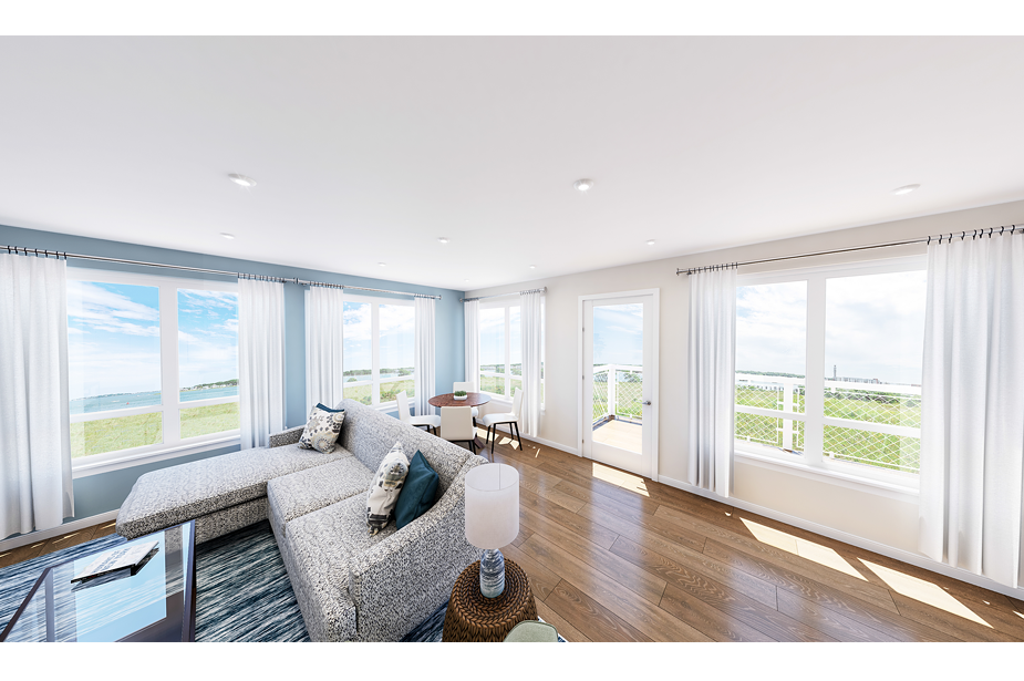 Couple with coffee mugs enjoying scenic views out the large windows at Seascape at Weymouth