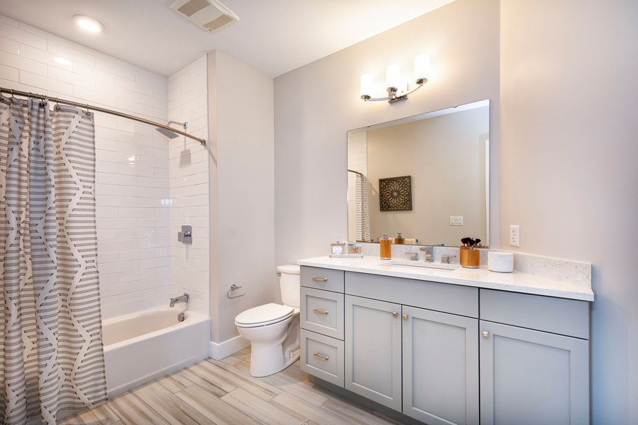 Couple with coffee mugs enjoying scenic views out the large windows at Seascape at Weymouth