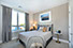 Couple with coffee mugs enjoying scenic views out the large windows at Seascape at Weymouth