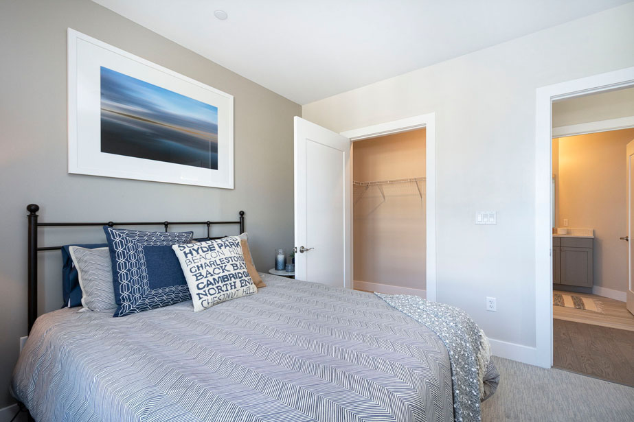 Couple with coffee mugs enjoying scenic views out the large windows at Seascape at Weymouth